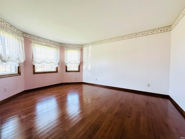 unfurnished room featuring dark hardwood / wood-style floors