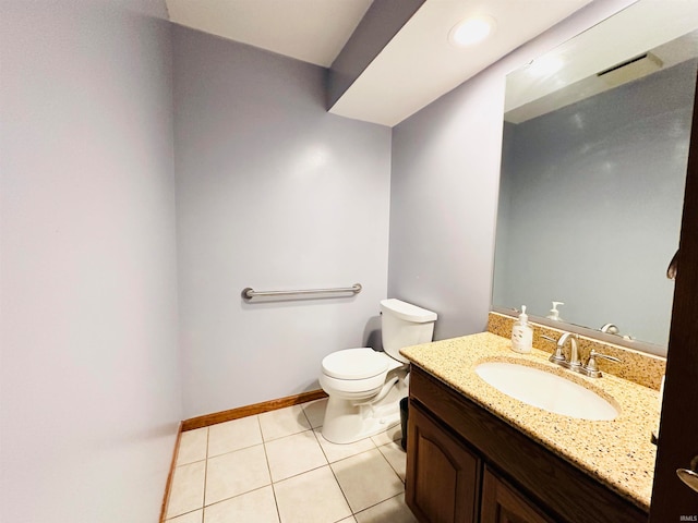 bathroom featuring vanity, toilet, and tile patterned floors