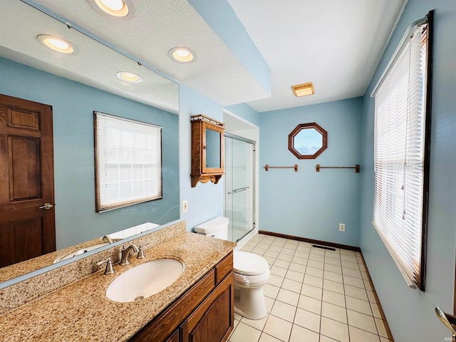 bathroom featuring vanity, a textured ceiling, a shower with shower door, tile patterned floors, and toilet