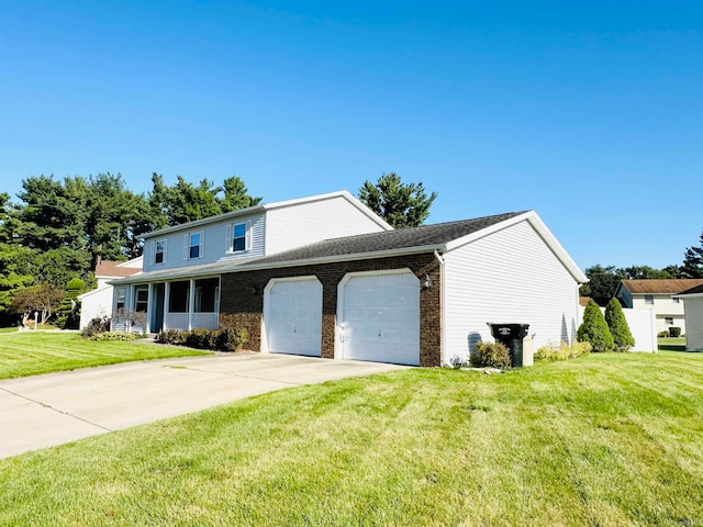 view of property featuring a front lawn and a garage