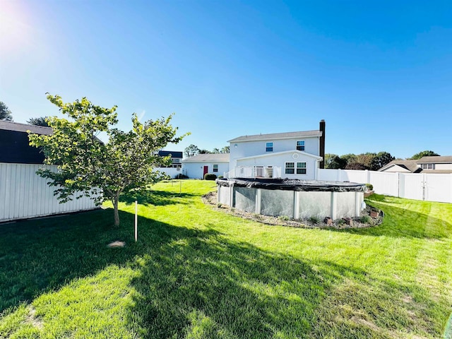 view of yard featuring a covered pool