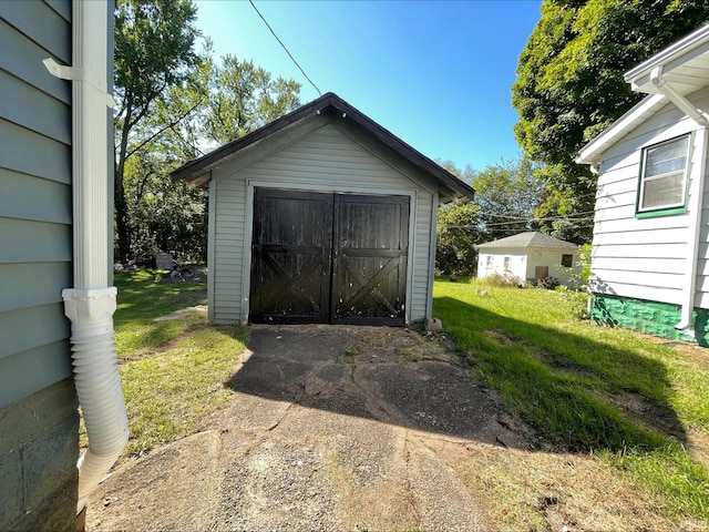 view of outdoor structure featuring a lawn