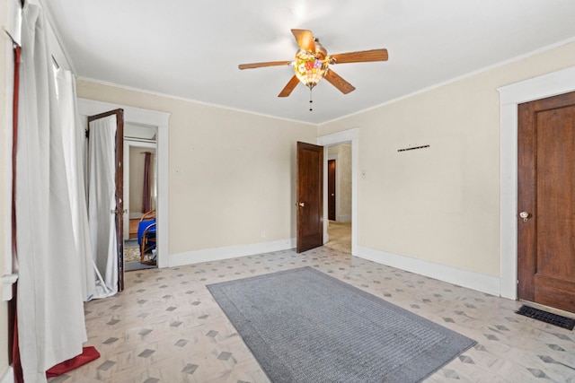 unfurnished bedroom featuring crown molding and ceiling fan