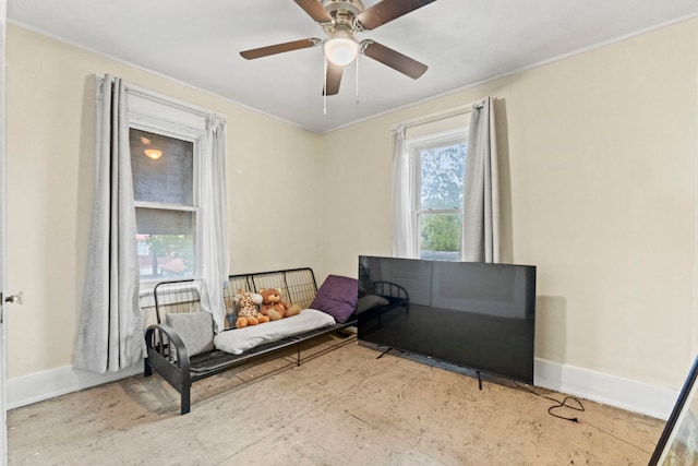 living area with ceiling fan