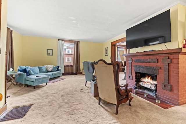 carpeted living room featuring a brick fireplace and a healthy amount of sunlight