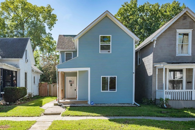 view of front property with a porch and a front lawn