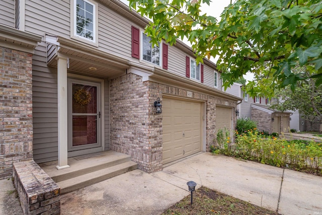 view of exterior entry featuring a garage