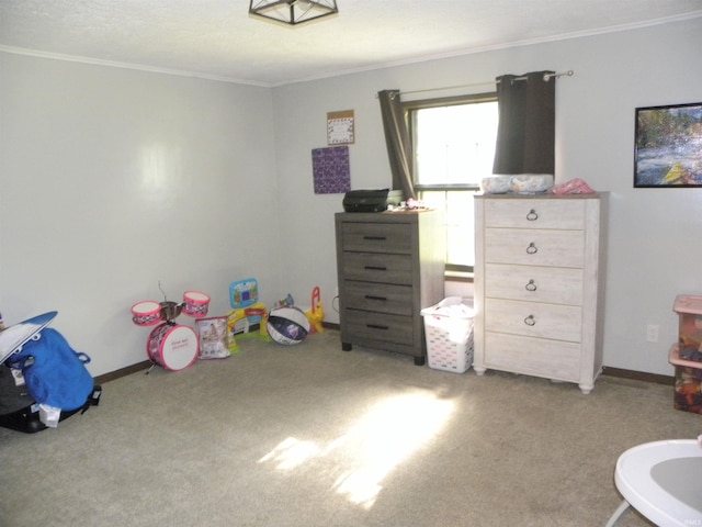 recreation room with carpet floors and crown molding