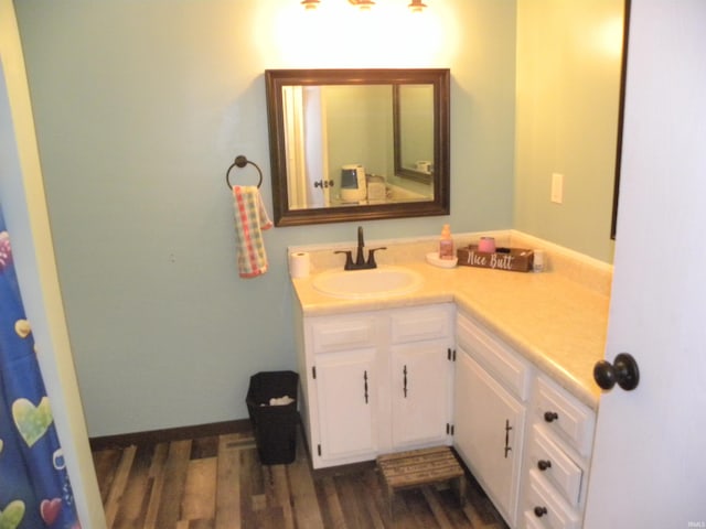 bathroom featuring vanity and hardwood / wood-style flooring