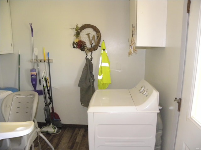 washroom with cabinets, washer / dryer, and dark wood-type flooring