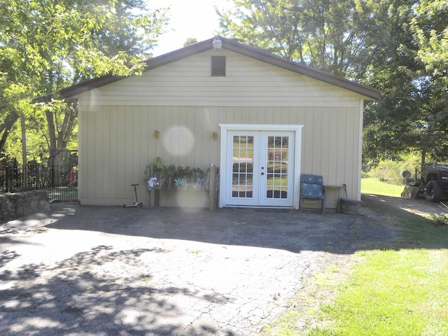 back of house featuring french doors