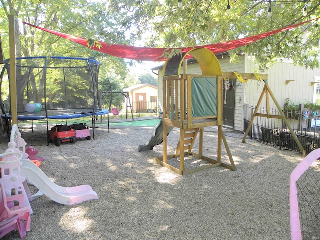 view of jungle gym with a trampoline