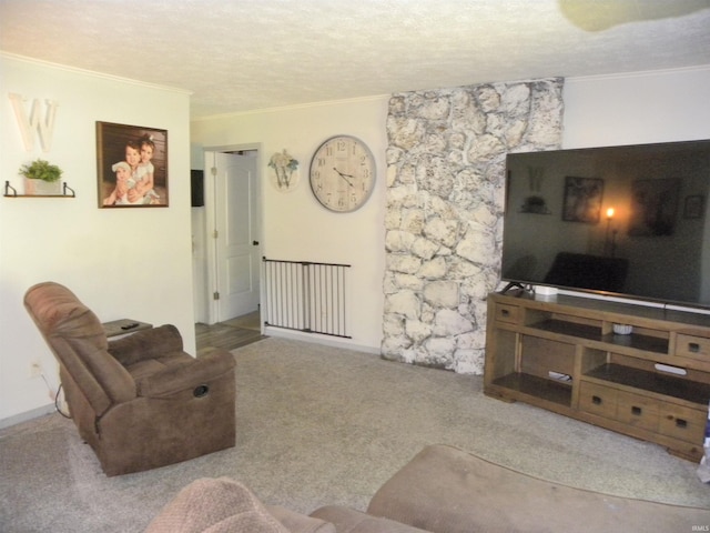 living room with a textured ceiling, ornamental molding, and light carpet