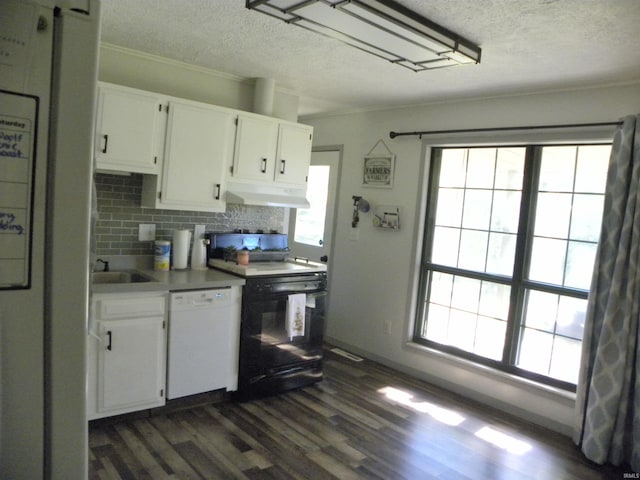 kitchen with white appliances, white cabinetry, dark wood-type flooring, and plenty of natural light