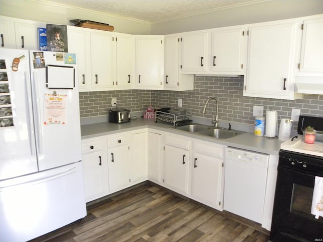 kitchen featuring white cabinets, dark hardwood / wood-style floors, sink, and white appliances