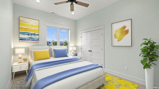 bedroom with carpet floors, ceiling fan, and a closet