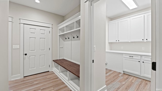 mudroom with light hardwood / wood-style flooring