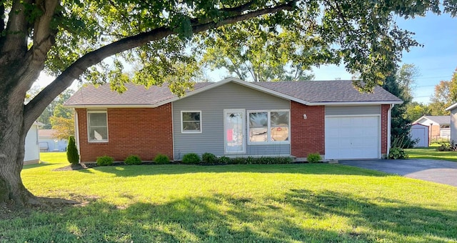 ranch-style house with a front yard and a garage