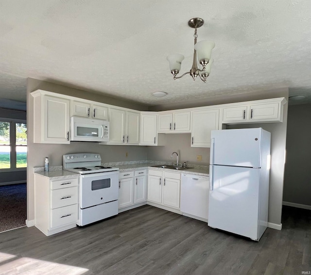 kitchen with dark hardwood / wood-style floors, sink, white cabinetry, white appliances, and decorative light fixtures