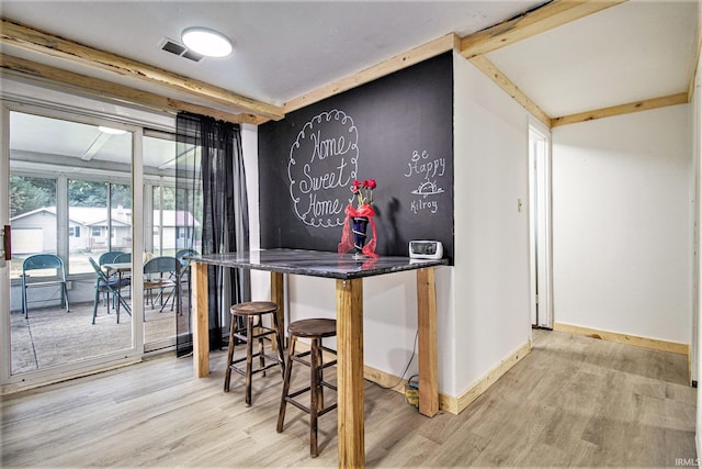 bar featuring hardwood / wood-style floors