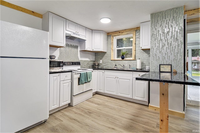 kitchen featuring white appliances, white cabinetry, light wood-type flooring, and kitchen peninsula