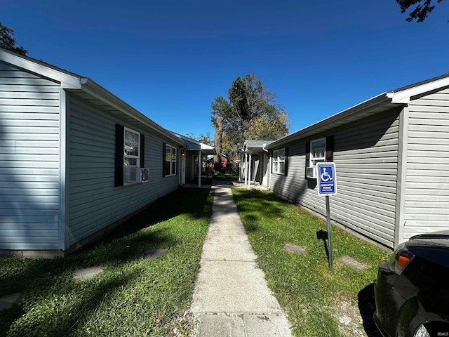 view of home's exterior with a yard