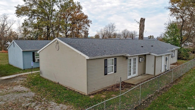 rear view of property featuring french doors