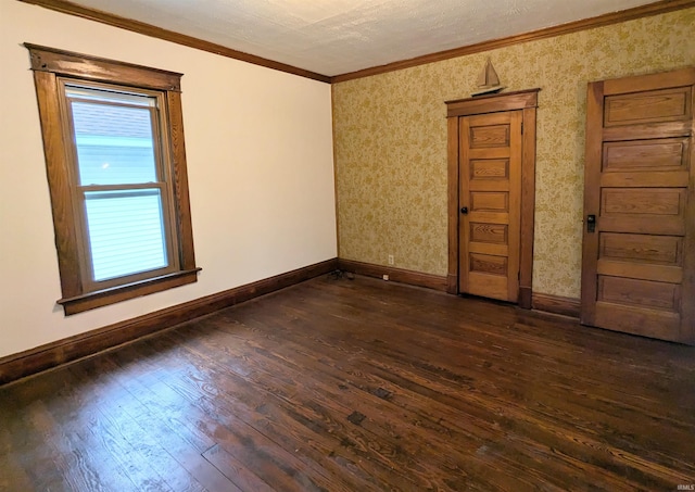 unfurnished room with crown molding and dark hardwood / wood-style flooring