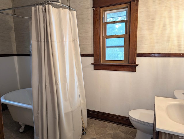 bathroom with tile patterned floors, a shower with curtain, vanity, and toilet