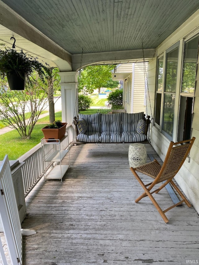 wooden terrace featuring a porch