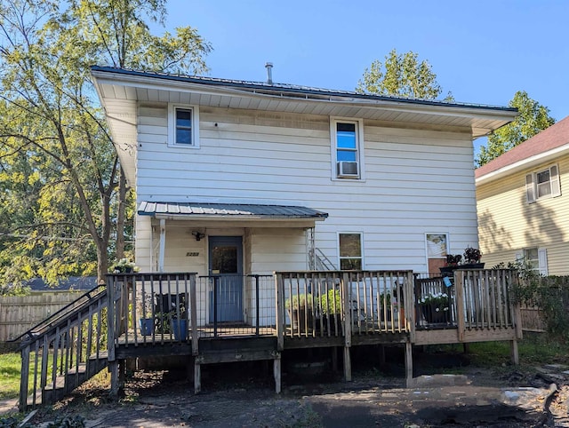 back of house featuring a deck