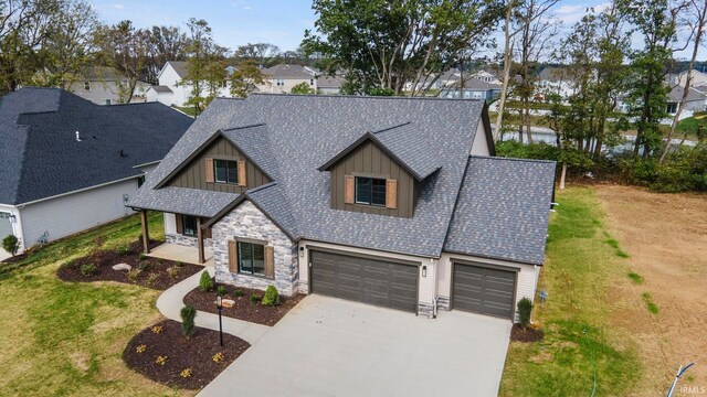 view of front of property featuring a garage and a front lawn