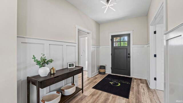 entryway with light hardwood / wood-style flooring