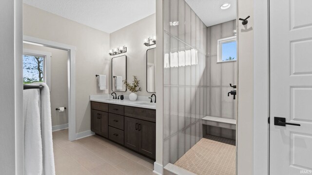 bathroom with vanity and a textured ceiling