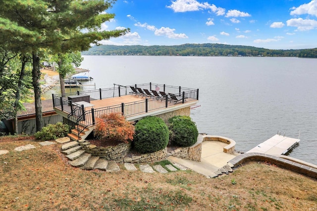 dock area with a deck with water view