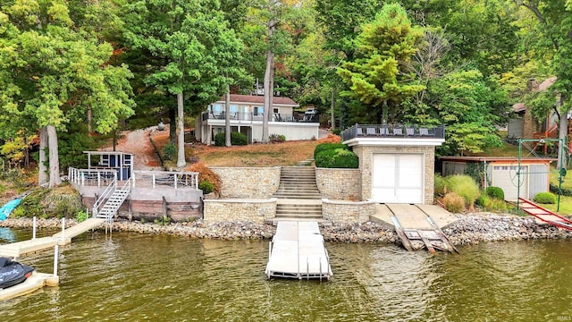 dock area featuring a deck with water view