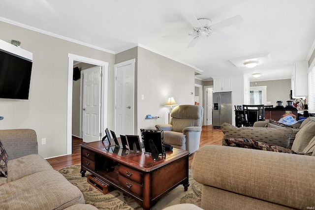 living room featuring ornamental molding, ceiling fan, and hardwood / wood-style flooring