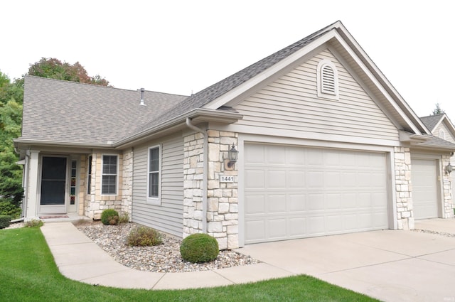 single story home with a garage