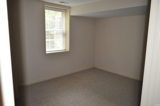 spare room featuring carpet