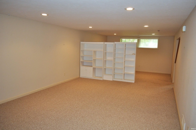 unfurnished room featuring light colored carpet