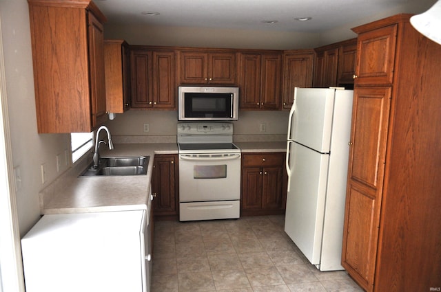 kitchen with white appliances and sink