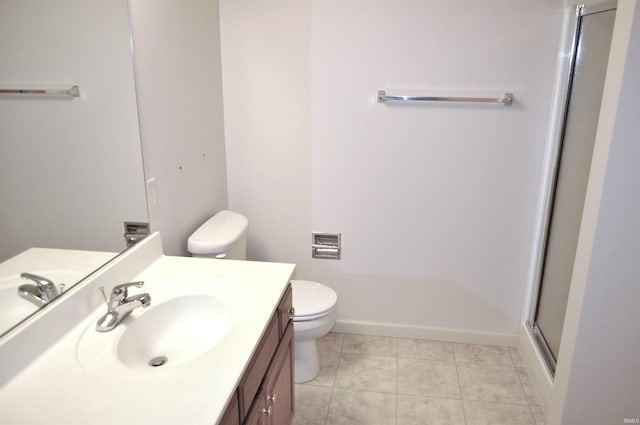 bathroom with tile patterned flooring, walk in shower, vanity, and toilet