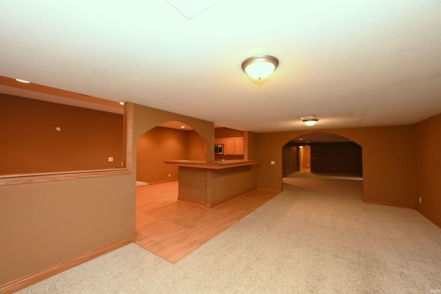 bar featuring light colored carpet