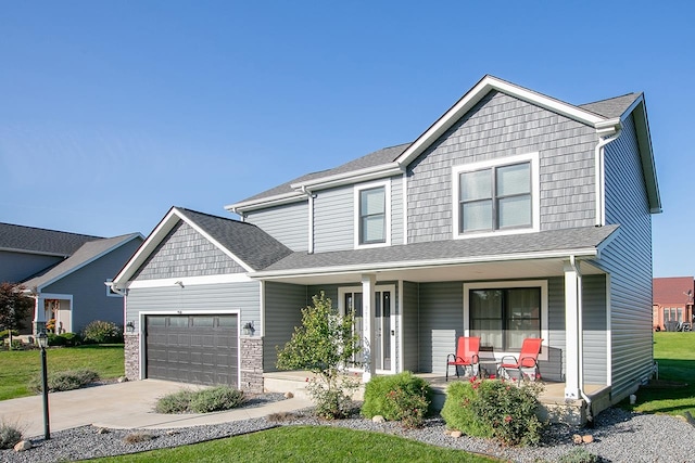 craftsman-style house with a front lawn, covered porch, and a garage