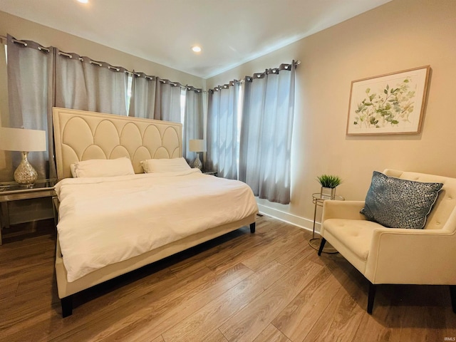 bedroom with hardwood / wood-style flooring