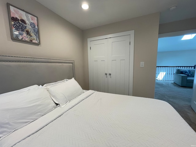 carpeted bedroom with a closet