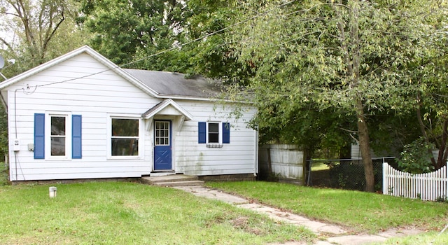 view of front of home with a front yard