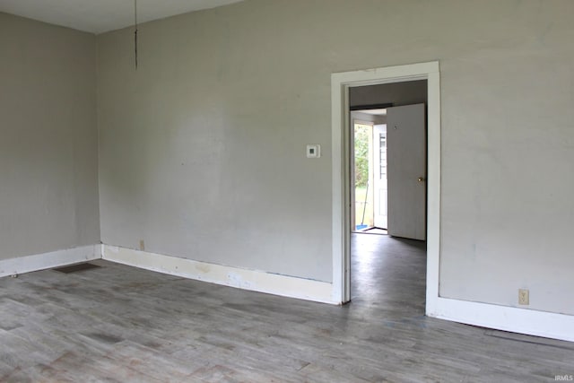 empty room featuring wood-type flooring