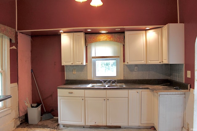 kitchen with sink and white cabinetry