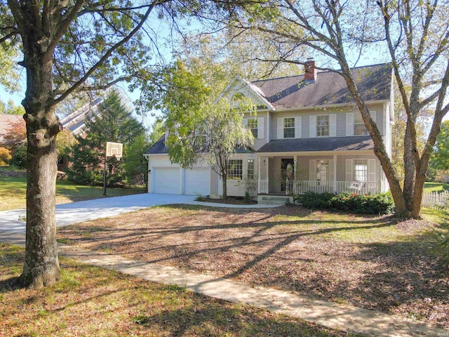 view of front of property with a porch and a garage